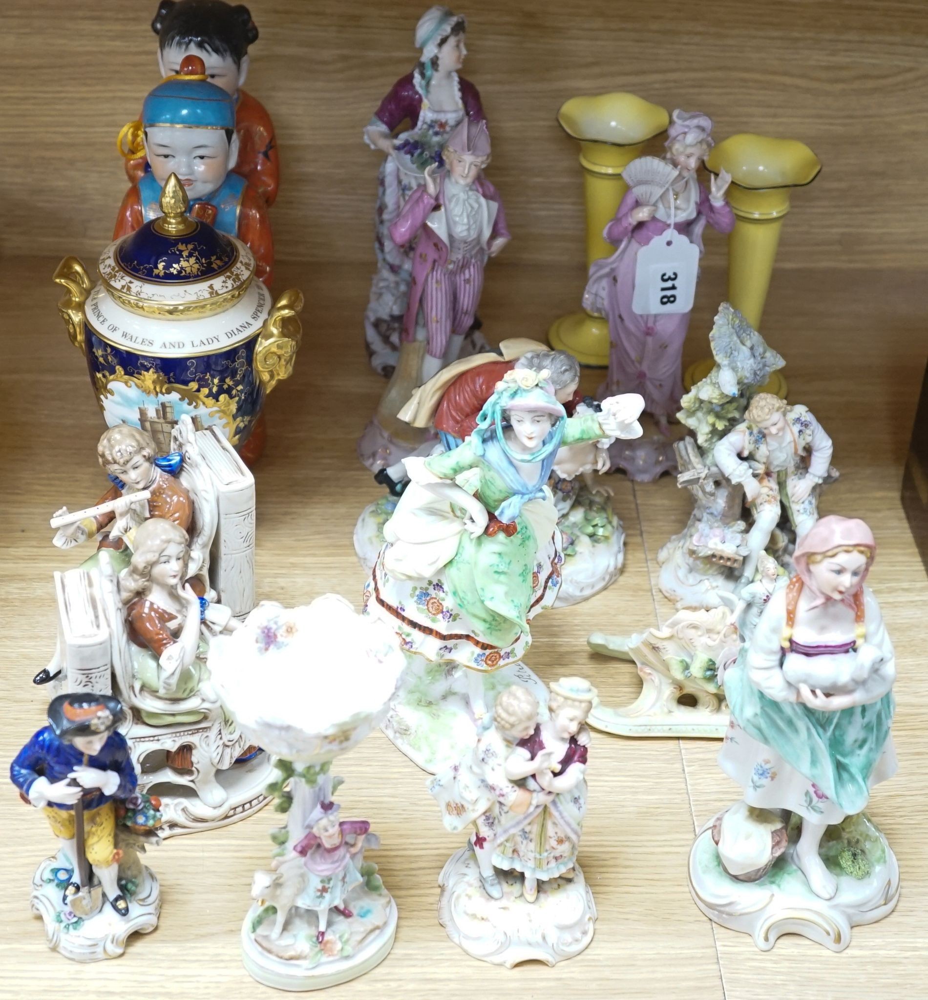 A collection of German and French porcelain figurines, Coalport commemorative urn etc.
